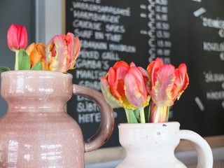 Tulips in a vase in a restaurant