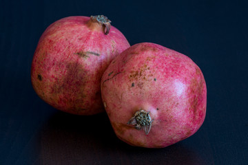 pomegranates on black background