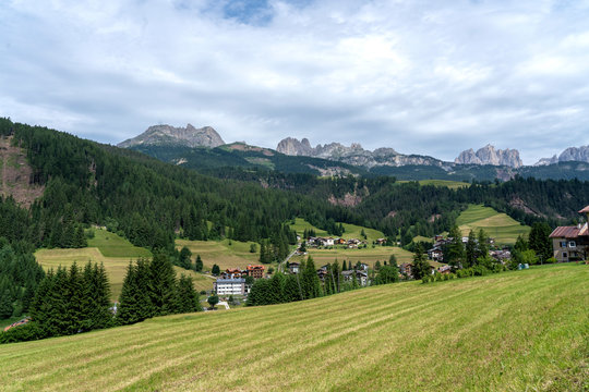 Soraga, little village in Val di Fassa, Trentino, italian Dolomites, Italy. View of Catinaccio range