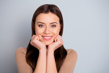 Close up photo amazing beautiful she her lady ideal perfect appearance hands arms cheeks overjoyed affectionate emotions feelings wear casual pastel brown pullover sweater isolated grey background