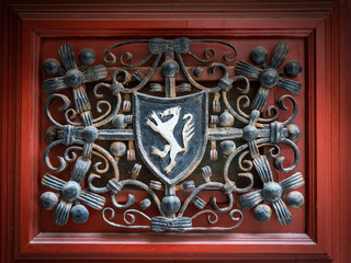 emblem of Cres with decoration and a red background