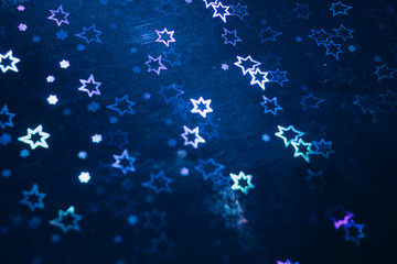 Abstract retro blurred background of glitter light. Blue color.