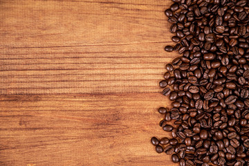 coffee beans and wood background.