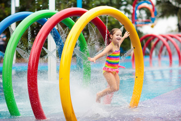 Kids at aqua park. Child in swimming pool.