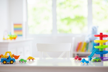 Little boy room. Toy cars at desk. Car toys.