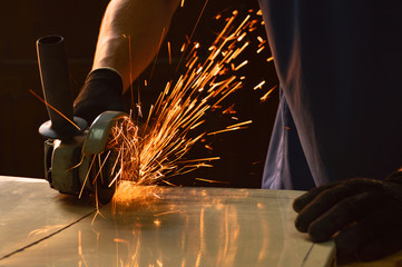 Close-up of a radial saw detaching sparks