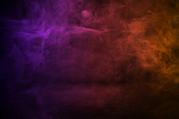 dark cement wall studio background with mist or fog, colorful smoke backdrop