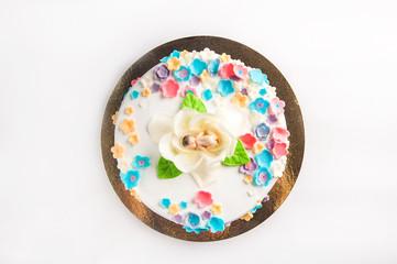 Cake with fruit, chocolate, flowers is isolated on a white background close-up and copy space.