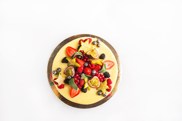 Cake with fruit, chocolate, flowers is isolated on a white background close-up and copy space.