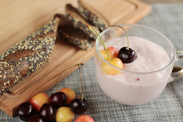 cherry yogurt fresh sweet cherries and baguette on table