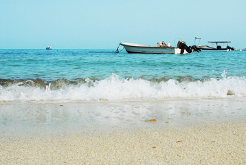 Fototapeta na wymiar Fishing boat at the sea in sunny day
