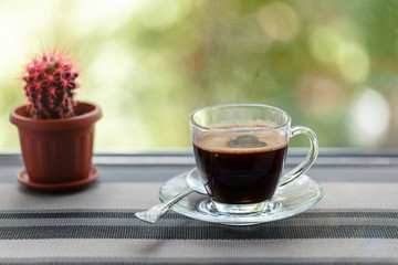 Freshly brewed morning coffee in a Cup, prepared for Breakfast. For good mood and good morning.