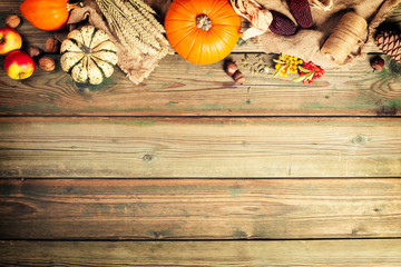 Autumn background - fallen leaves and healthy food on old wooden table