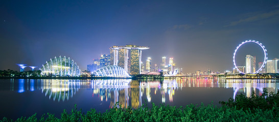 Fototapeta na wymiar Panorama of Singapore cityscape. beautiful business modern building skyscraper around Marina bay at night. landmark and popular for tourist attractions : Singapore, 9 May 2019