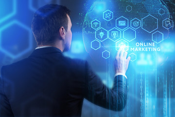 The concept of business, technology, the Internet and the network. A young entrepreneur working on a virtual screen of the future and sees the inscription: Online marketing