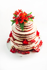 Cake with fruit, chocolate, flowers is isolated on a white background close-up and copy space.