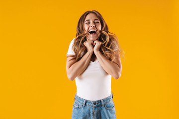 Portrait of a cheerful young casual girl standing