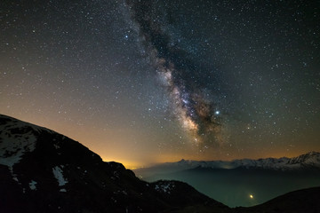 Milky way galaxy stars over the Alps, Mars and Jupiter planet, snowcapped mountain range, astro night sky stargazing - obrazy, fototapety, plakaty