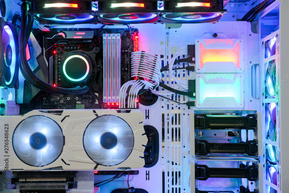 Poster close-up and inside desktop pc gaming and cooling fan cpu system with multicolored led rgb light sho