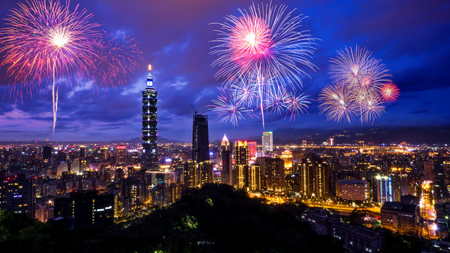 Firework with cityscape night light view of Taipei. Taiwan city skyline at twilight time, public scene from view point at the Mountain.