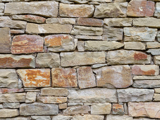 Fragment of a wall from a natural stone
