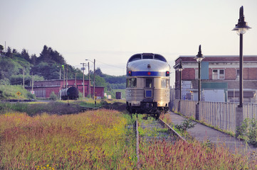 Passenger train to Prince George stands by the old building of the station.