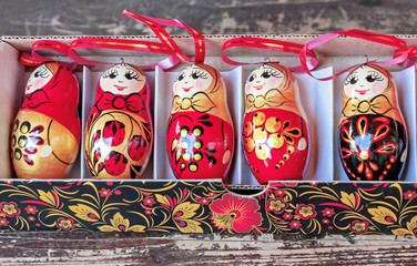 Matryoshka is a national Russian souvenir. Russian wooden doll matryoshka on the counter of the...