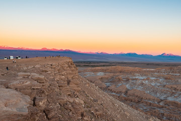 Tourist visiting the Moon Valley at the Salt Mountain Range, San Pedro de Atacama, Atacama Desert, Chile