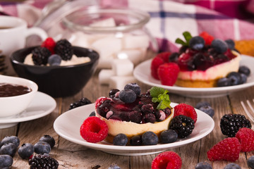 Cheesecakes with mixed berries. 