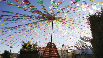 Typical colorful flags blowing in the wind - they are used for decoration at the June Festivals (aka festas de Sao Joao), popular festivities in Brazil (Oeiras, Brazil)
