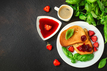 Toast, strawberry jam and coffee - breakfast (tasty snack, basil, dessert). food background. top view. copy space