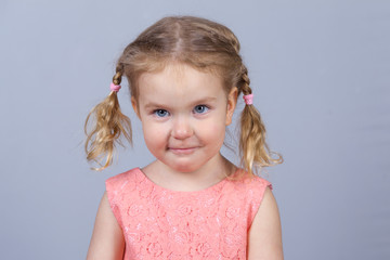 Portrait of beautiful girl and pink dress, studio