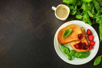 Toast, strawberry jam and coffee - breakfast (tasty snack, basil, dessert). food background. top view. copy space