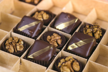 Handmade chocolate candies in a beautiful box. Present box of chocolate sweets