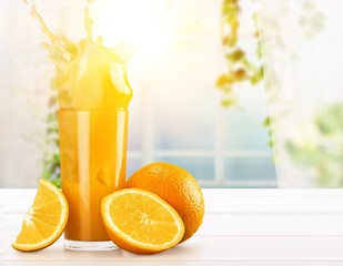 Orange juice and slices of orange on background © BillionPhotos.com