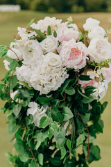 Wedding flowers closeup. Decoration made of roses and decorative plants