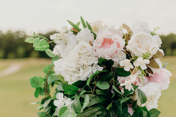 Wedding flowers closeup. Decoration made of roses and decorative plants