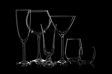 Glassware silhouettes on black.