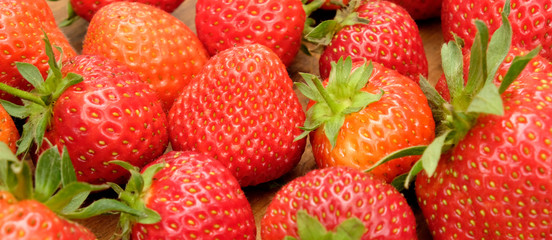 bright red strawberries with green stalks