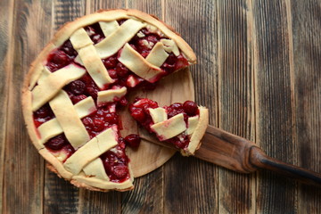 Delicious homemade cherry pie on wooden background Summer and autumn baked Top view