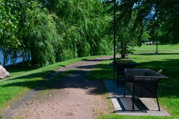 Benches along a Path next to the Chicago River at Ping Tom Memorial Park in Chinatown Chicago