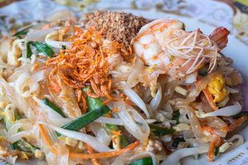 noodles Pad Thai topping with shrimp or prawns in dish. Thai food.