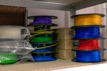 3D printing material, ABS filament, PLA (Polylactic Acid),  PVA Filament.  Colored polymer in coils...
