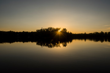 Naklejka na ściany i meble Sunset on Spider Lake in the Chequamegon National Forest.