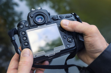 A photographer adjusts the camera.
