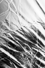 Crumpled silver material as abstract background