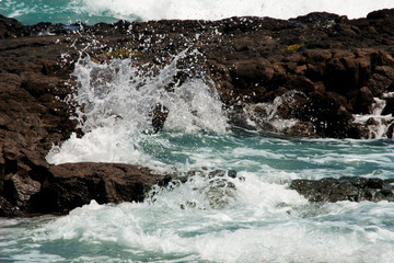 waves crushing at the rocky coast of Lanzarote