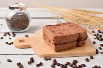 Coffee Bread and Coffee Bean for breakfast on wooden background