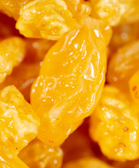 Yellow raisins as background