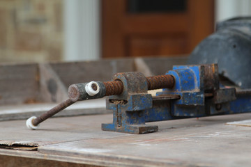 Old clamp use for clamped pieces of wood in carpentry workshop.